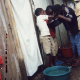 A. (Female, 14Yrs Old, Dandora Slum, Kenya), These are Children eating in a Dirty Sufuria. I would like them to have clothes, shelter, education and food